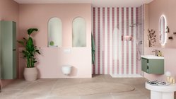 Ein modernes Badezimmer mit sanften rosa Wänden, einer eleganten Dusche und einer stilvollen grünen Waschtischkombination.